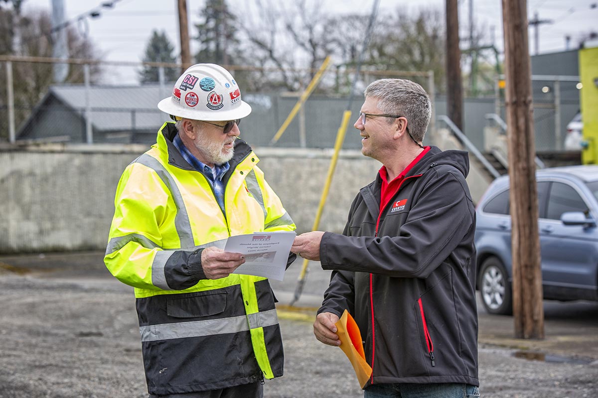 construction-worker-happy-client Charter team member talking with a client