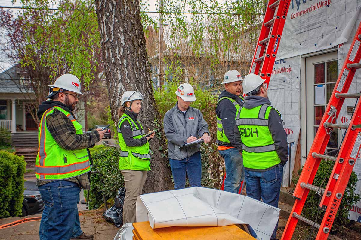 construction-crew-planning-restoaration-work Construction crew planning a restoration project